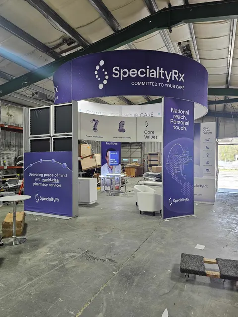 SpecialtyRx booth by Purple Exhibits: specialtyRx 20x20 island booth in a purple and white scheme