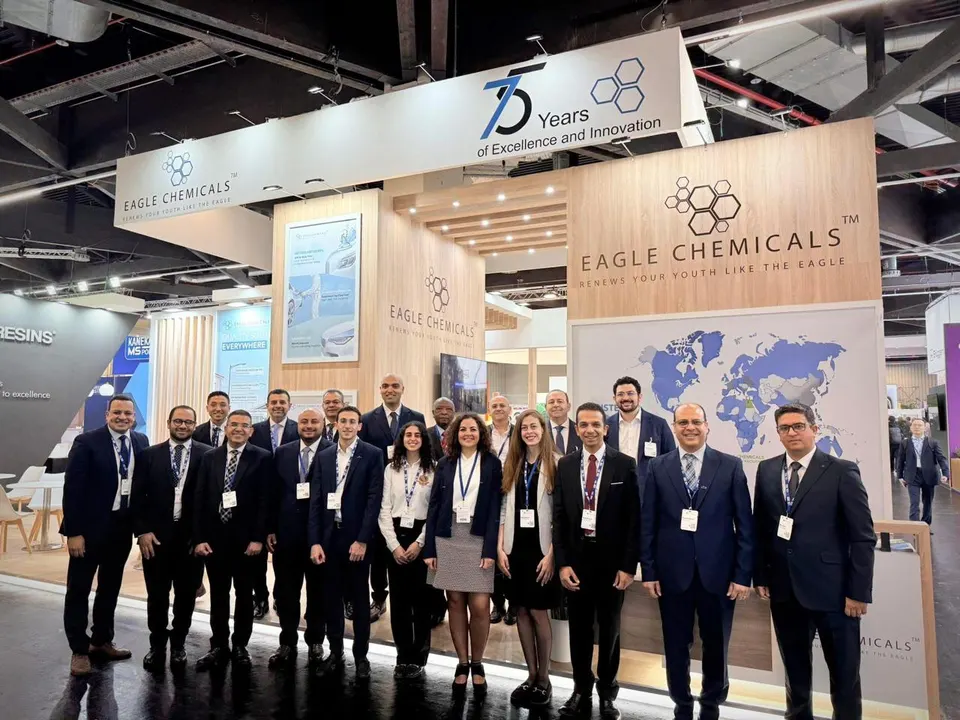 Eagle Chemicals booth by Purple Exhibits: wood-finish booth for Eagle Chemicals with a 75 Years hanging header sign, a reference for planning a JLC LIVE booth