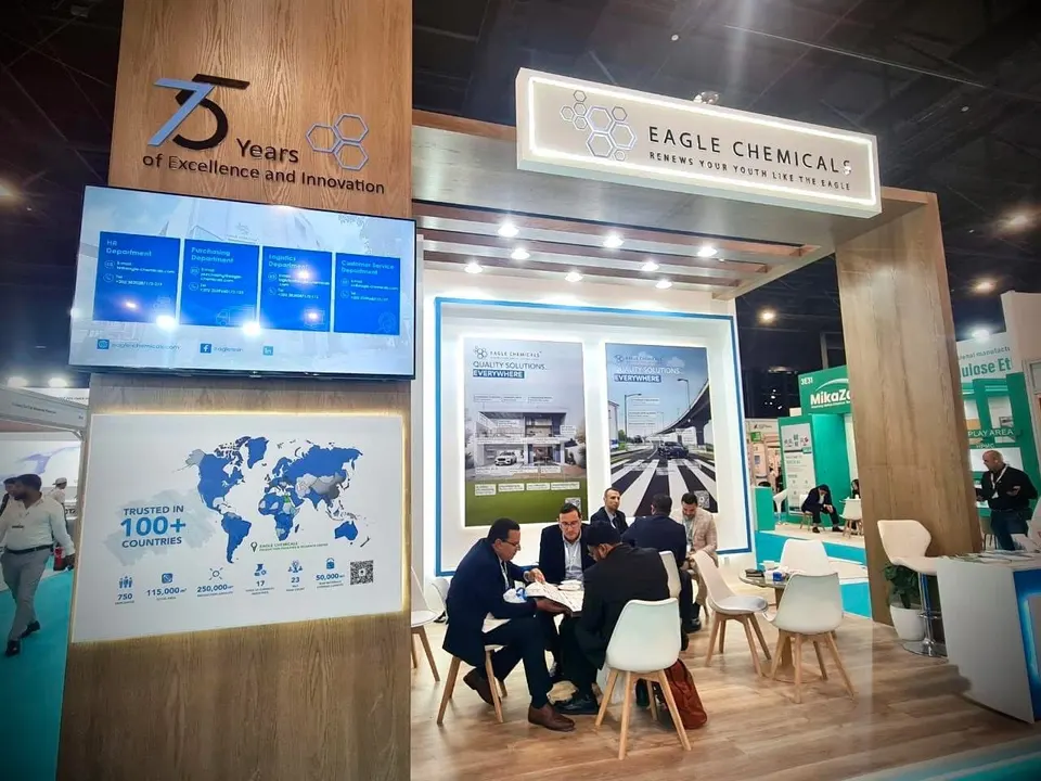 Eagle Chemical booth by Purple Exhibits: wood-panelled Eagle Chemical booth with a backlit white logo lightbox, a Purple build like the booths we plan for SOT Annual Meeting & ToxExpo