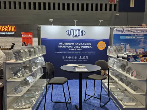 Ducon booth by Purple Exhibits: small blue Ducon aluminum-packaging inline booth with a blue back-wall graphic