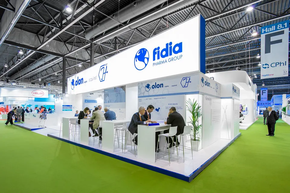 Olon / Fidia Pharma Group booth by Purple Exhibits: bright white and blue Olon and Fidia Pharma Group booth