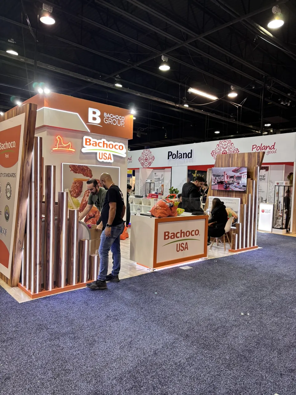 Bachoco USA booth by Purple Exhibits: orange and white Bachoco USA booth