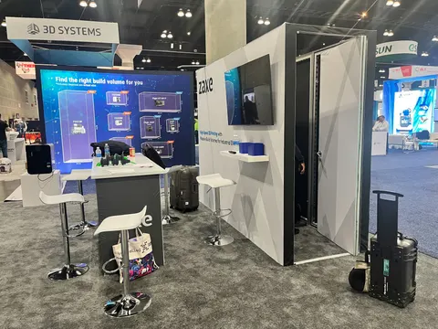 Zaxe booth by Purple Exhibits: zaxe 3D-printer inline booth with a blue backlit product-selector wall, white counter