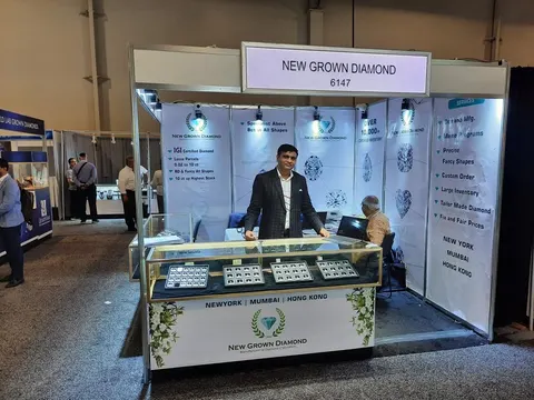 New Grown Diamond booth by Purple Exhibits: new Grown Diamond inline booth with white walls with diamond graphics