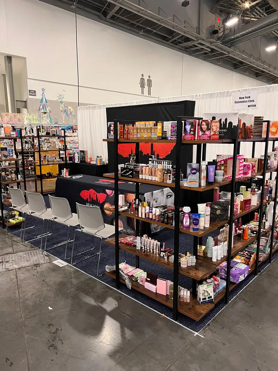 New York Cosmetics Corp. booth by Purple Exhibits: corner inline booth for New York Cosmetics with black metal, the kind of booth we build for SOURCING Las Vegas