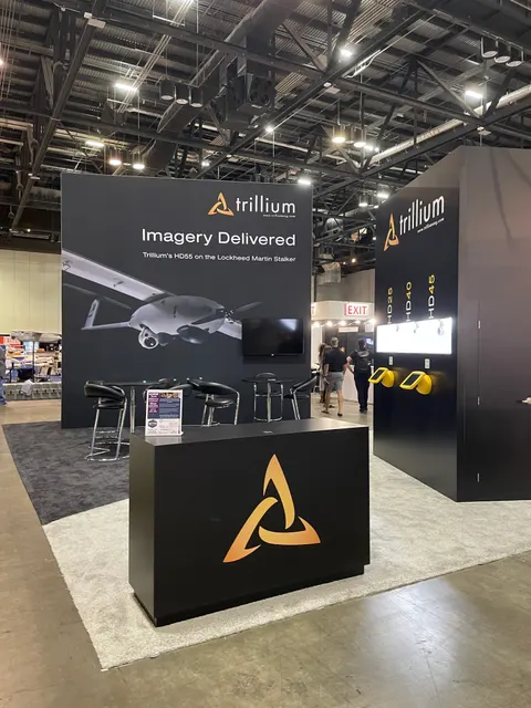 Trillium booth by Purple Exhibits: matte black island booth for Trillium