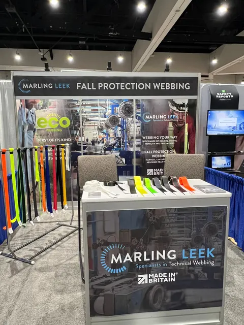 Marling Leek trade show booth built by Purple Exhibits: Compact Marling Leek inline booth with a Fall Protection Webbing header, factory-photo graphic walls, a rack of colourful webbing samples and a branded counter disp