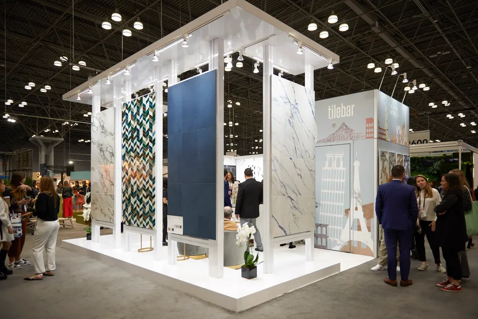 TileBar booth by Purple Exhibits: open white island booth with slender pillars, an overhead canopy, Purple work to compare for your AHR Expo booth