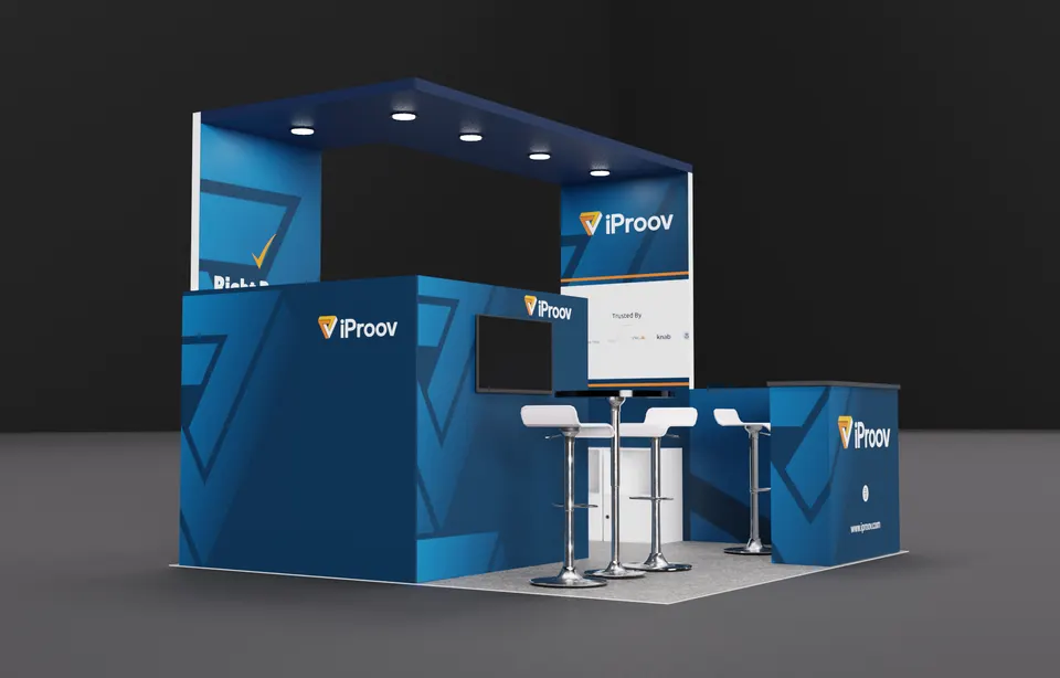 Purple Exhibits booth design concept: Render of a blue iProov island booth with a spotlit overhead canopy frame, geometric wall graphics, a wall-mounted screen, high table with white stools and a branded counter.