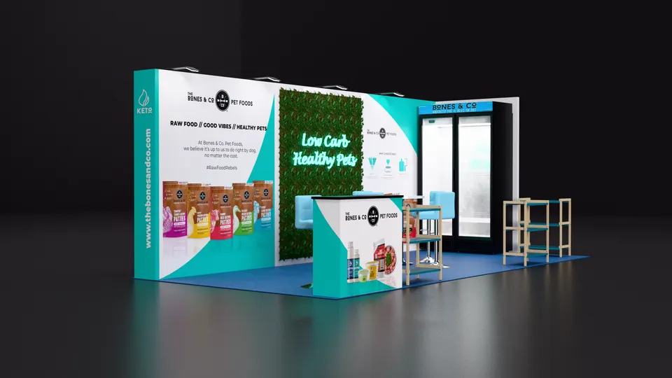 Purple Exhibits booth design concept: Render of a teal and white inline booth for Bones & Co pet food with a living green wall reading Low Carb Healthy Pets, pet food bag graphics, a display counter, wooden shelving and a glass freezer unit on blue flooring.