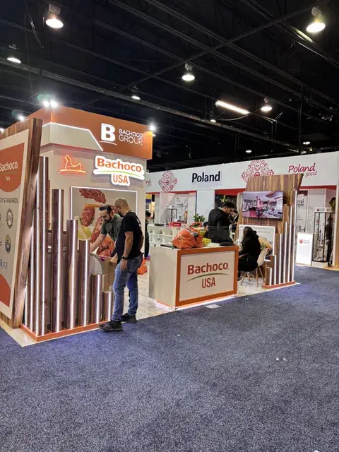 Bachoco USA food trade show booth by Purple Exhibits with wood slats, orange branding and a sampling counter