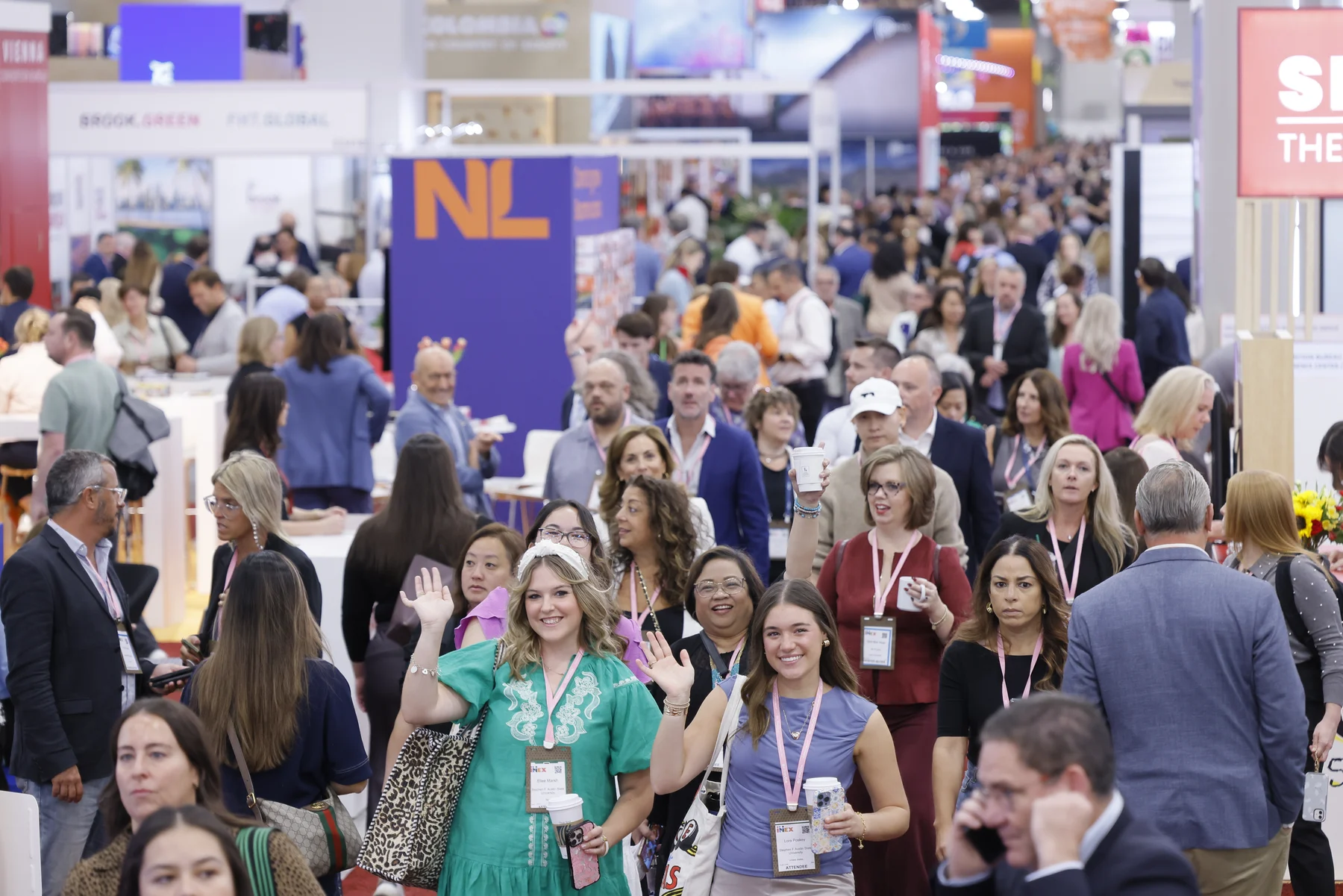 Conversations across the IMEX America show floor Attendees walk, talk, and meet exhibitors on a busy IMEX America show floor.