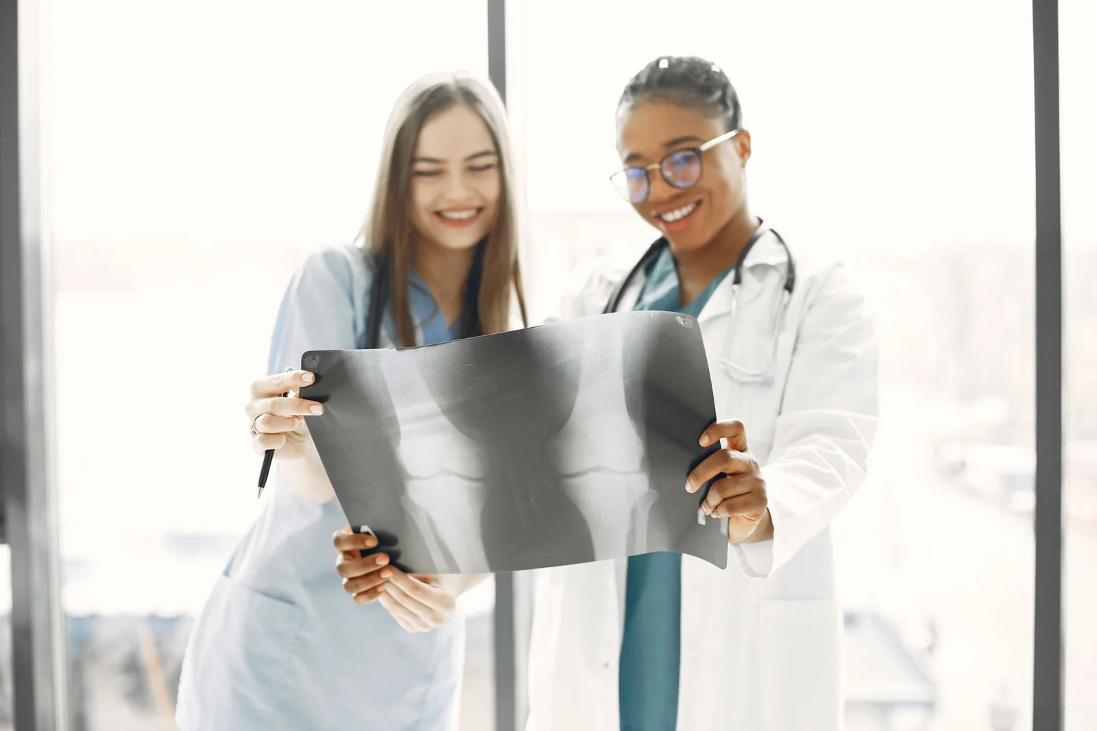 Two women healthcare professionals reviewing an X-ray together