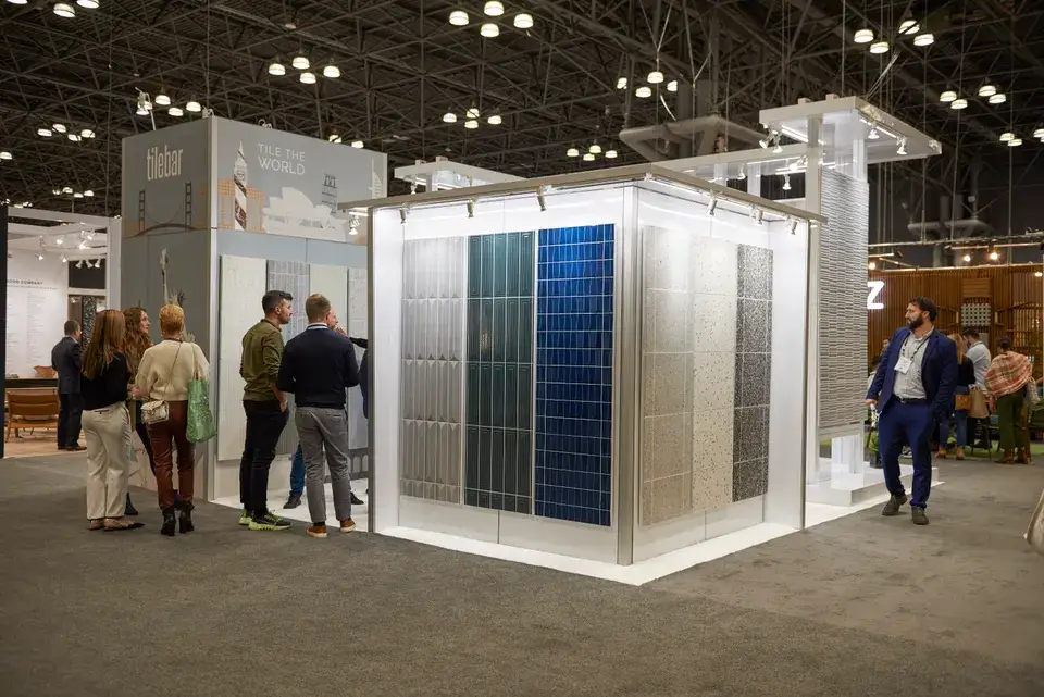 Attendees at a TileBar island booth built by Purple Exhibits