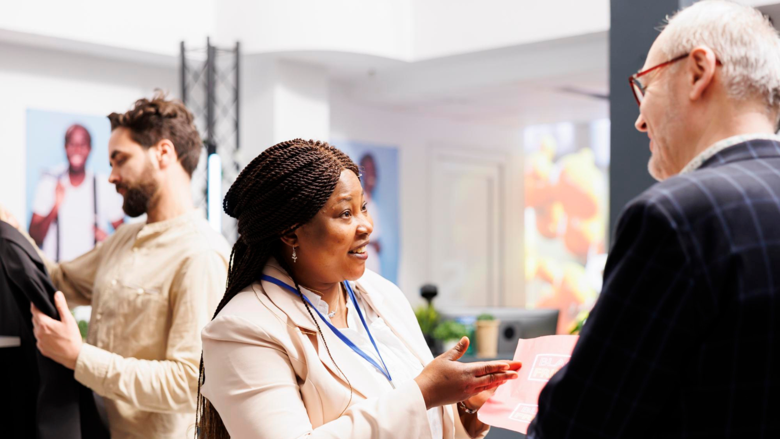Booth staff building relationships with visitors inside a custom space by Exhibit Fabrication Company Orlando and Branded Event Displays Orlando.