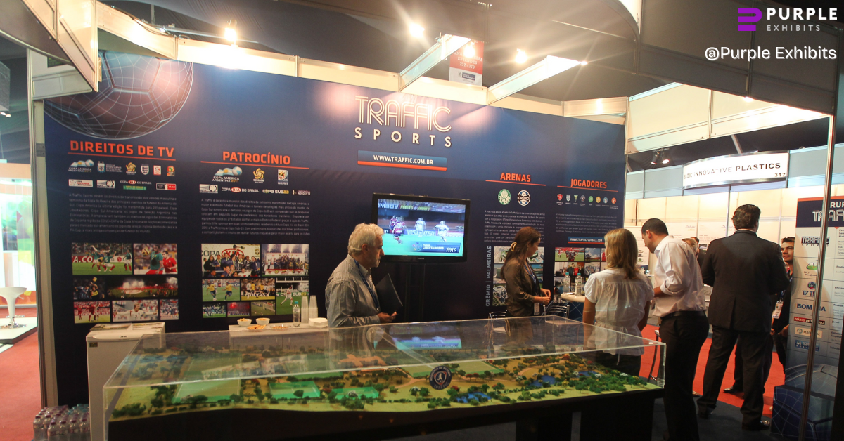 Busy trade show booth with live displays and attendee engagement, demonstrating effective Custom Exhibits NYC solutions driven by strategic NYC Exhibit Design.