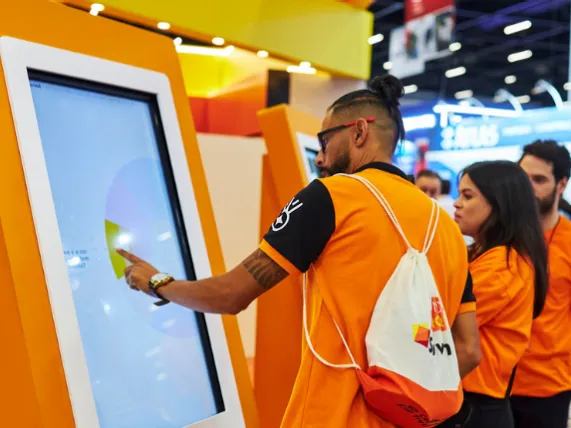 Interactive touchscreen kiosk rental for attendee engagement at a trade show