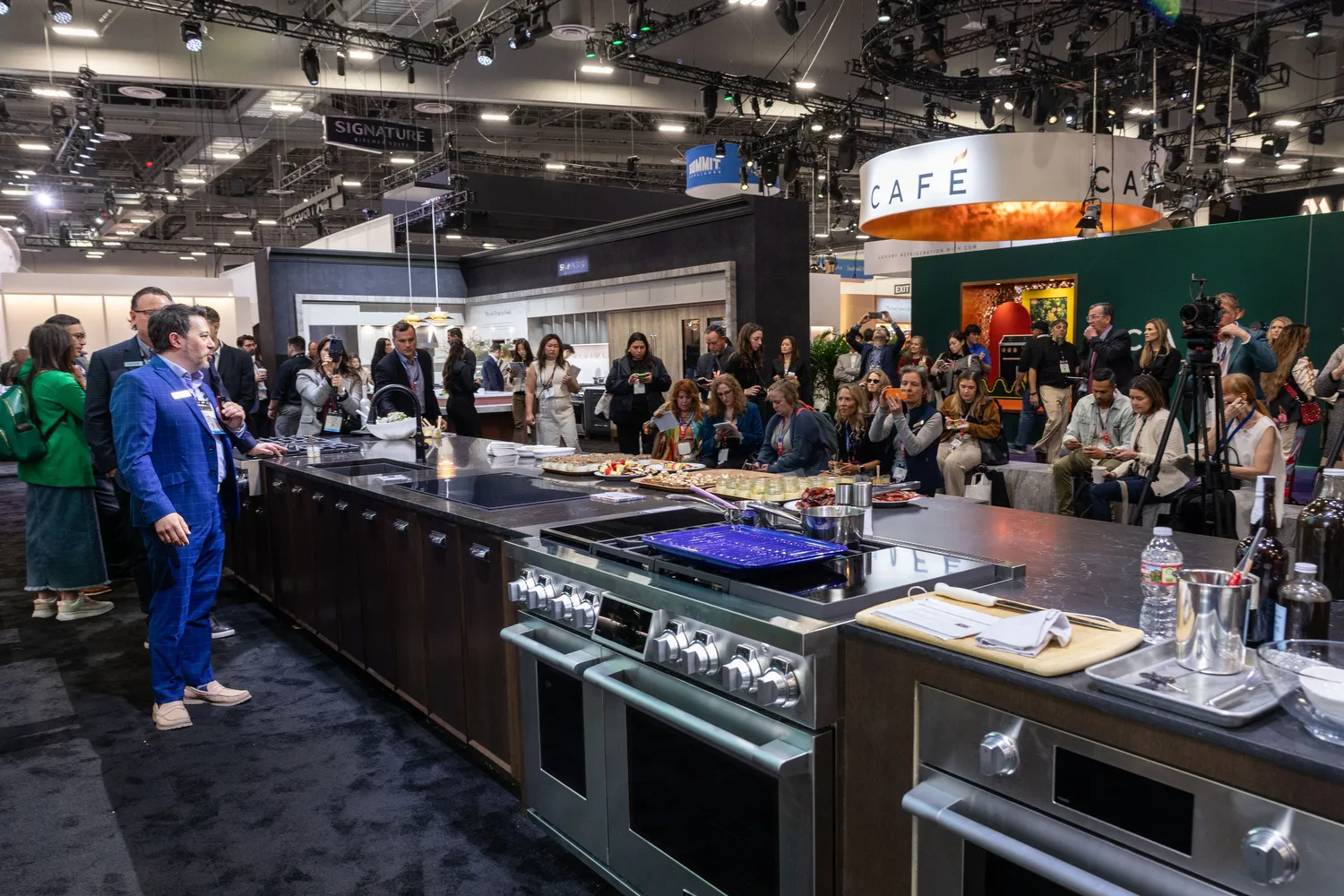 Presenter leading a live kitchen demonstration for attendees at KBIS