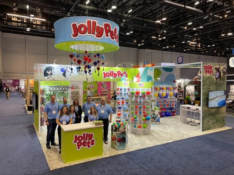 Island exhibit booth with an overhead hanging sign at Global Pet Expo