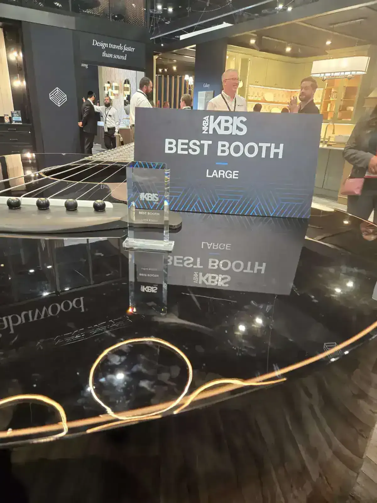 KBIS Best Booth Large award displayed inside an award-winning kitchen and bath exhibit