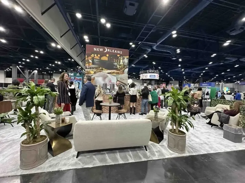 New Orleans hybrid trade show booth with custom graphics, lounge furniture and meeting areas