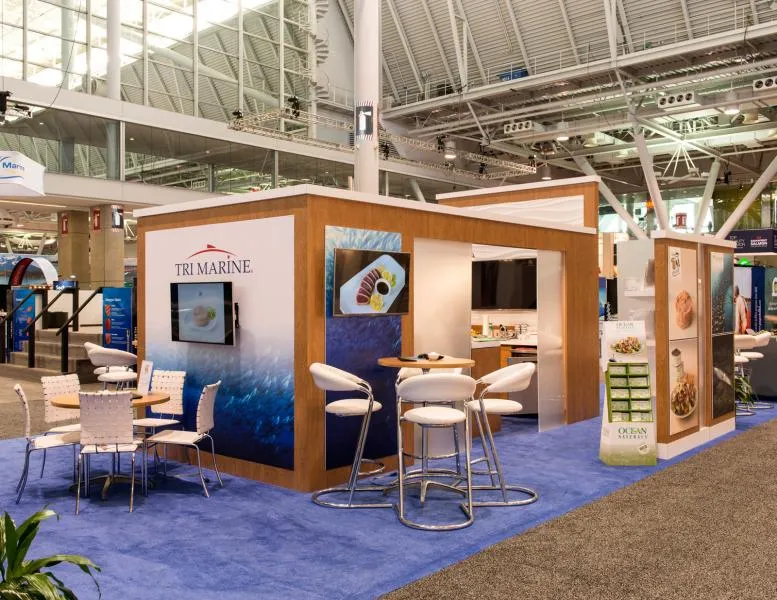 Custom rental trade show booth with branded meeting and demonstration areas