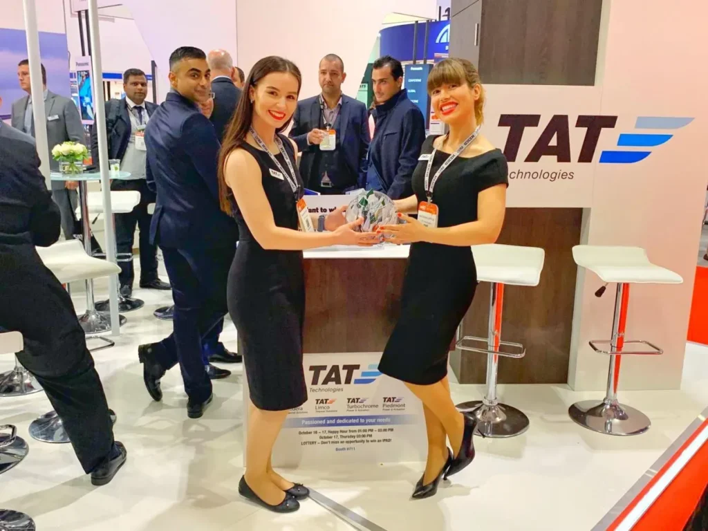 Business professionals meeting inside a modern trade show booth