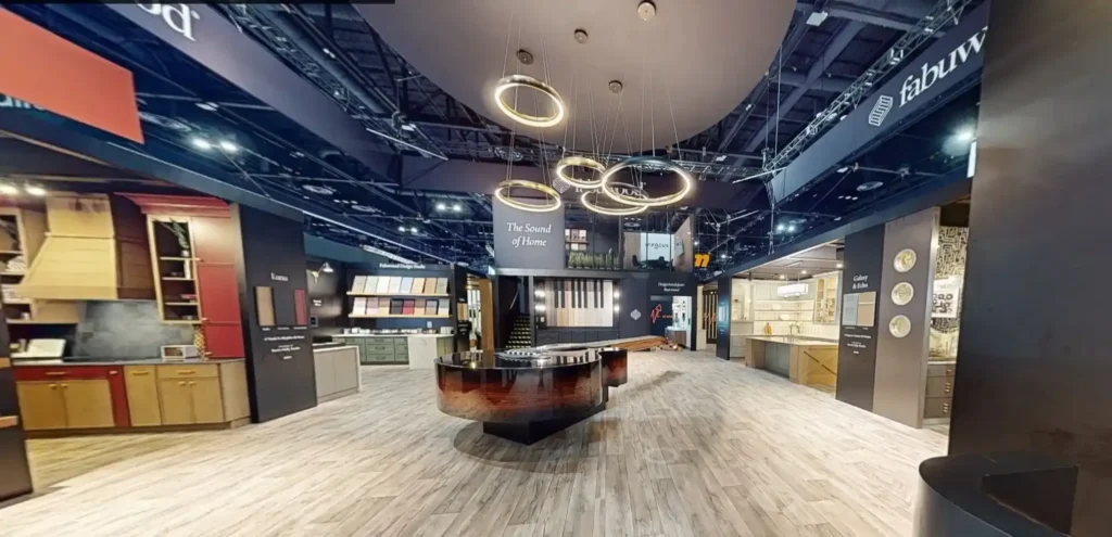 Interior view of a KBIS exhibit integrating cabinetry displays, lighting and visitor circulation