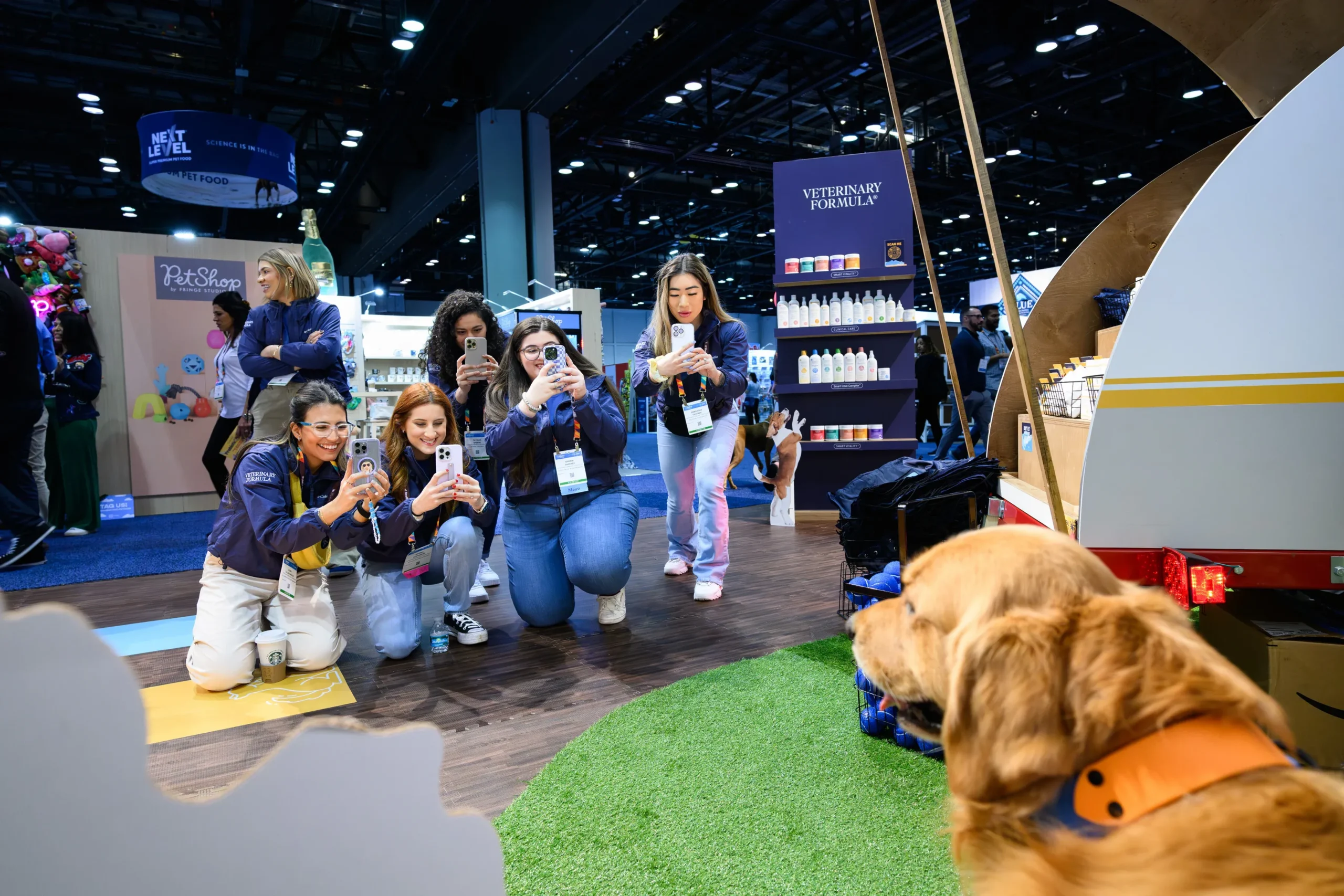 Approved dog demonstration inside a pet industry trade show booth