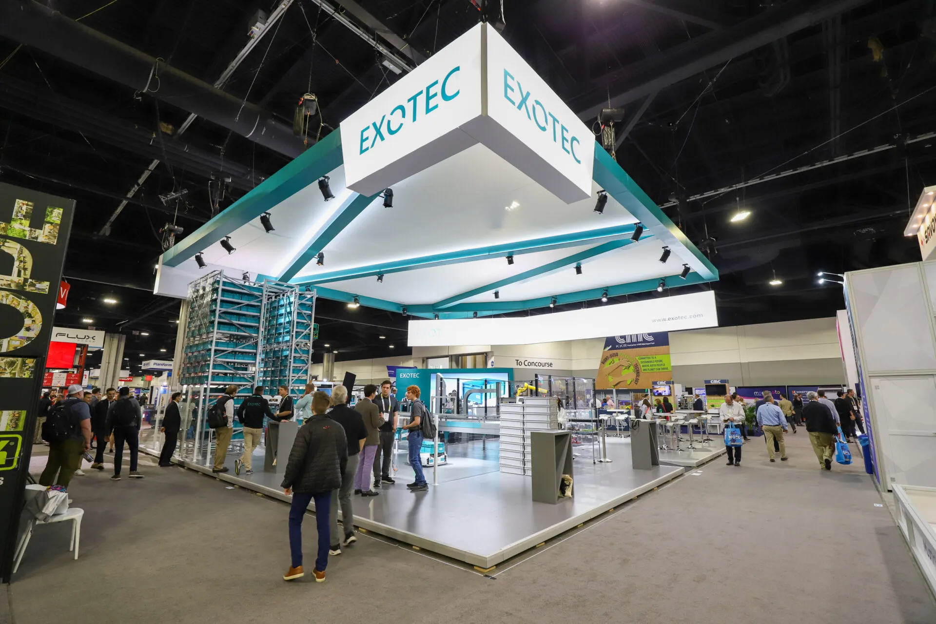 Large Exotec robotics exhibit with live demonstrations and attendees at MODEX in Atlanta