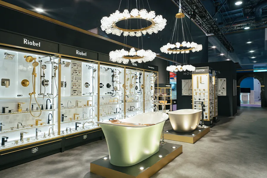 Award-winning luxury KBIS bath exhibit with illuminated freestanding tubs and dramatic product displays