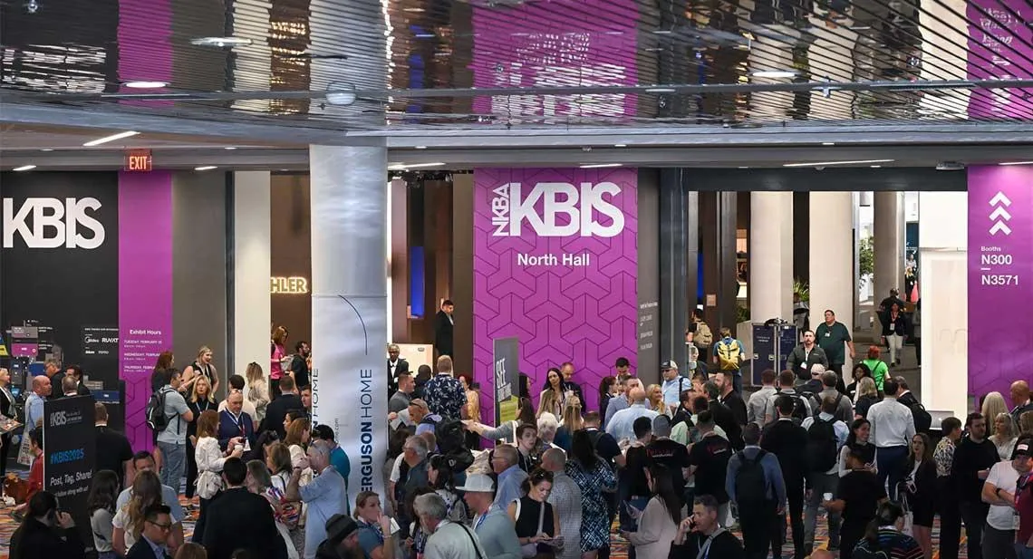 KBIS attendees entering the Las Vegas trade show beneath prominent KBIS signage