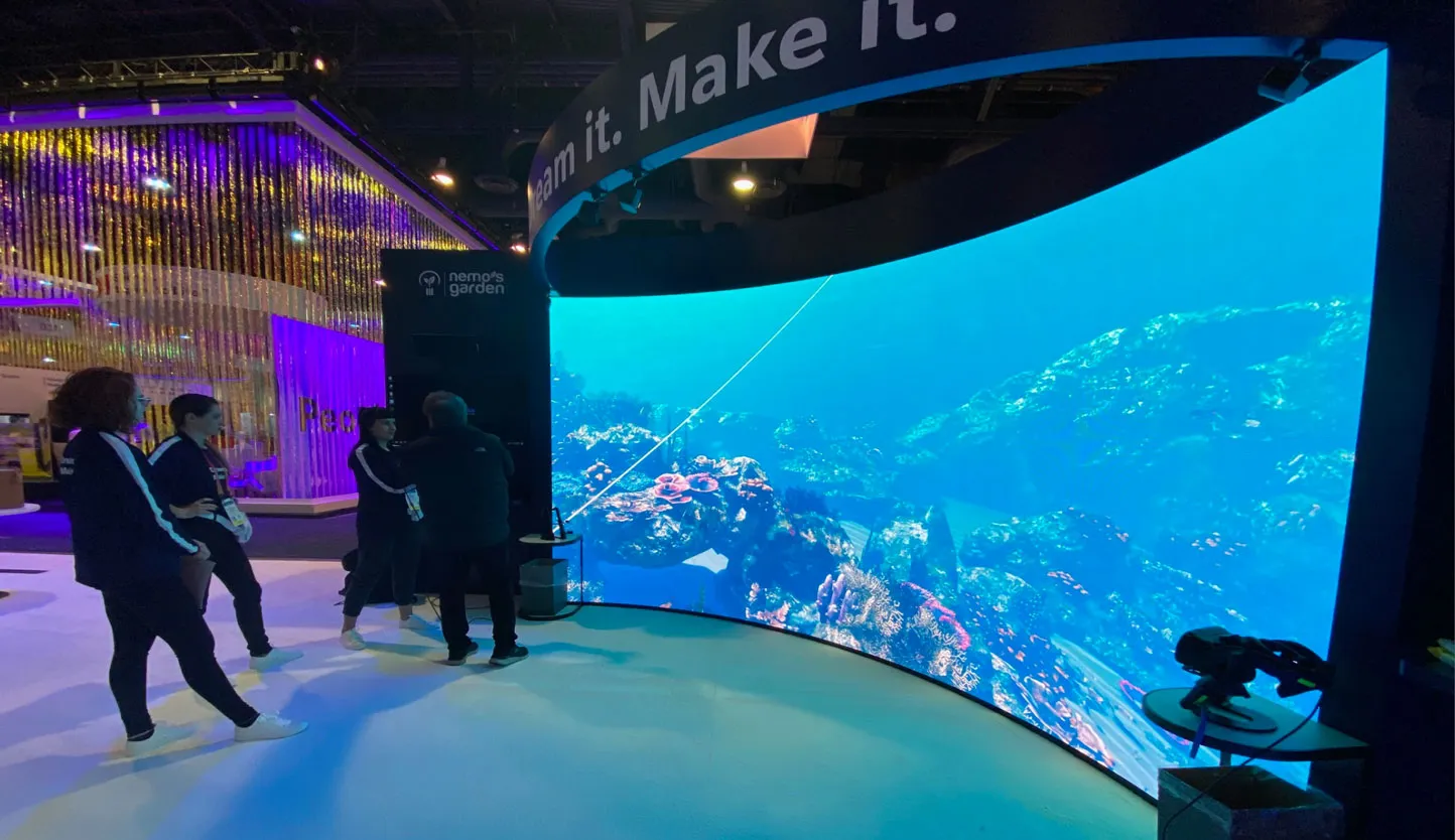LED video wall integrated into a custom Purple Exhibits trade show booth