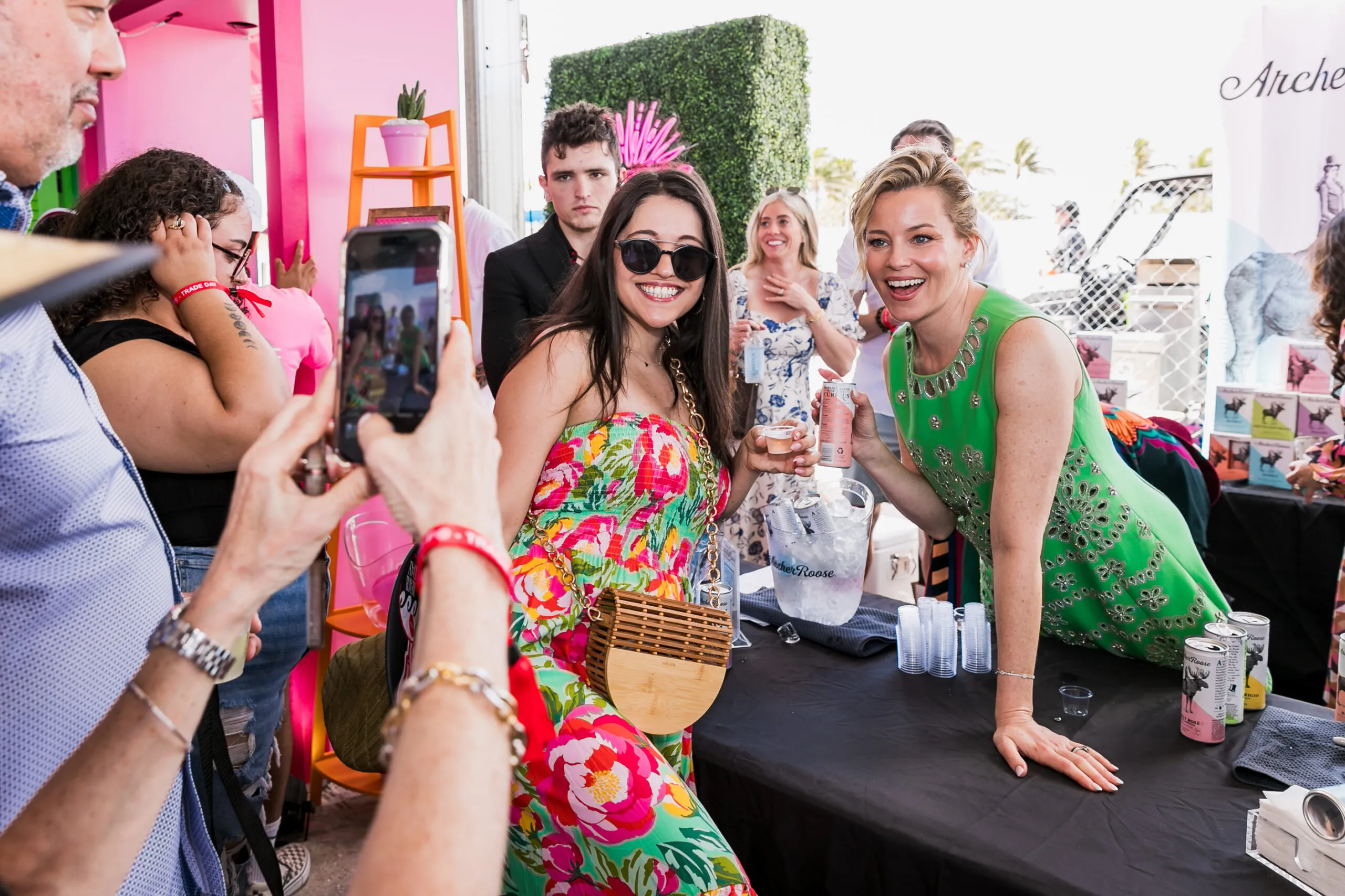Attractive female promotional representatives engaging guests at an interactive product-sampling activation in Miami