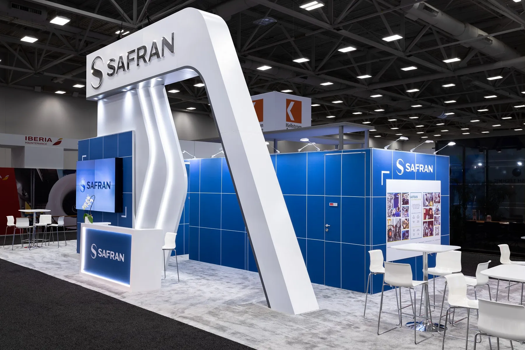 Large Safran aviation exhibit with illuminated branding, video displays and meeting areas at MRO Americas