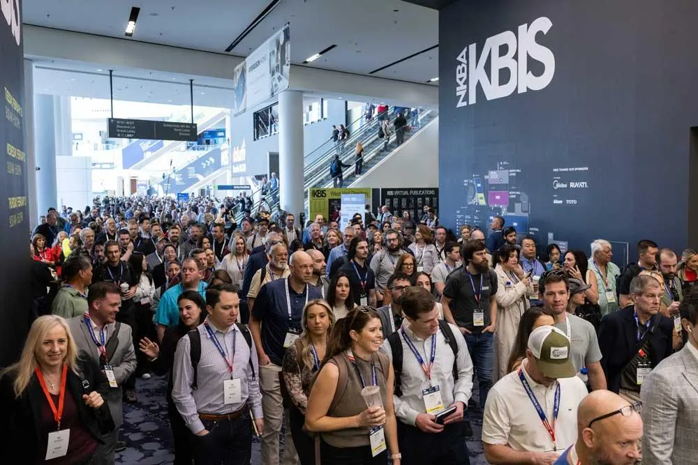 Crowds entering KBIS in Las Vegas beneath the large KBIS show logo
