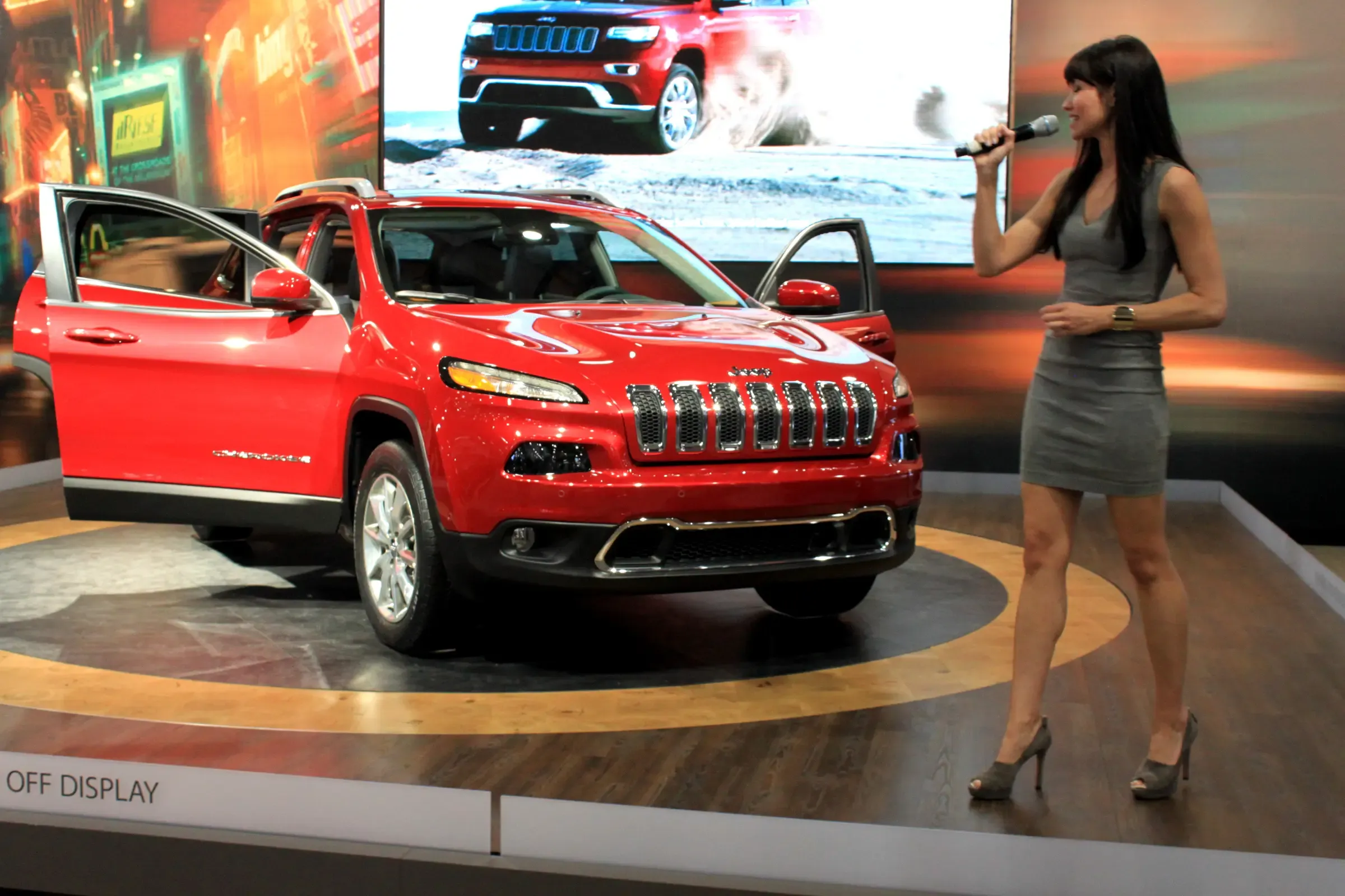 Promotional model presenting a Jeep vehicle exhibit at the New York International Auto Show