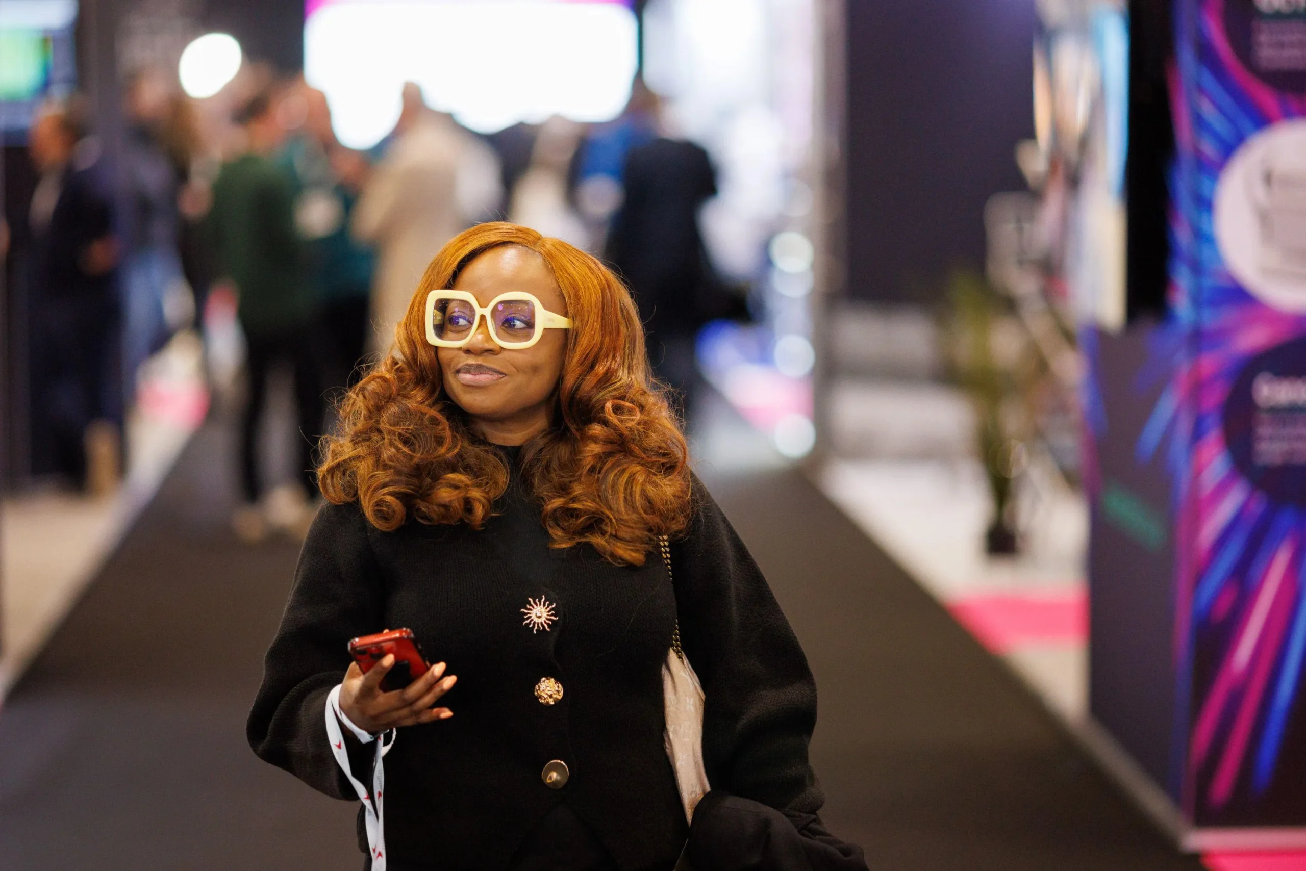 Glamorous eyewear model wearing white sunglasses at Vision Expo West in Las Vegas