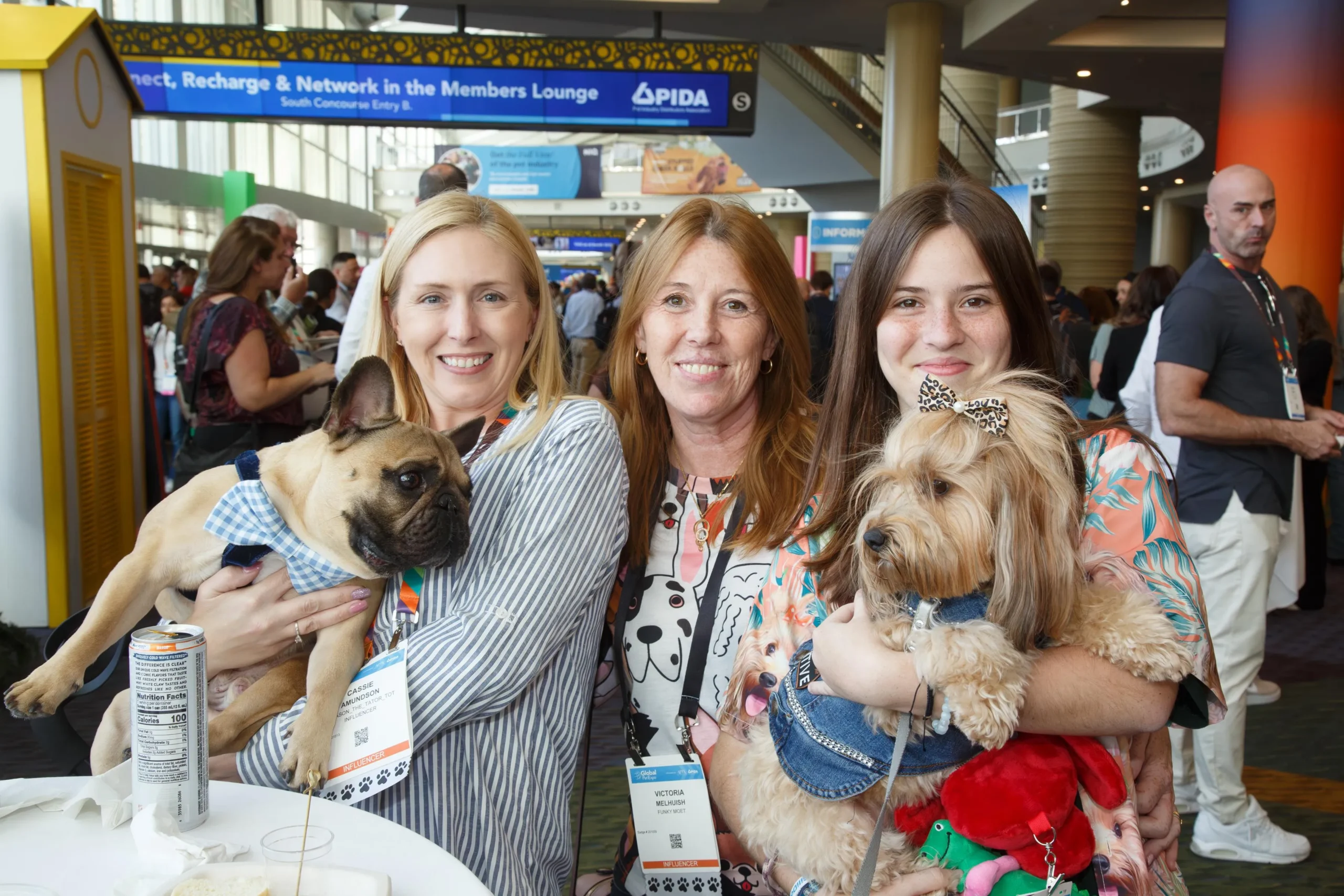 Pet industry exhibitors networking on the Global Pet Expo show floor