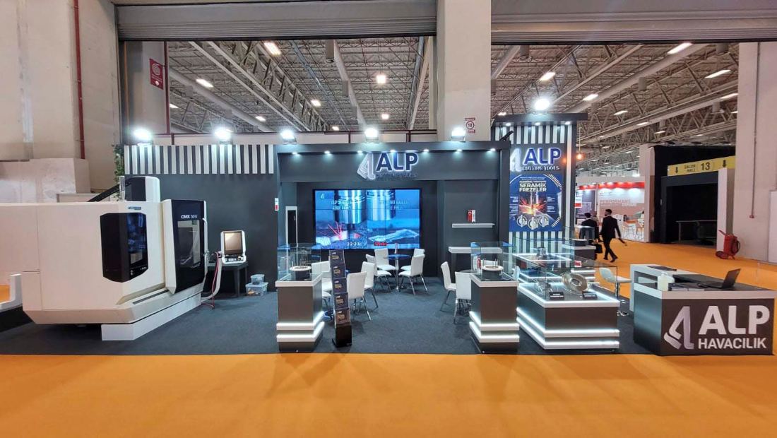 ALP Cutting Tools 10x20 inline trade show booth at Maktek with backlit header and product display cases