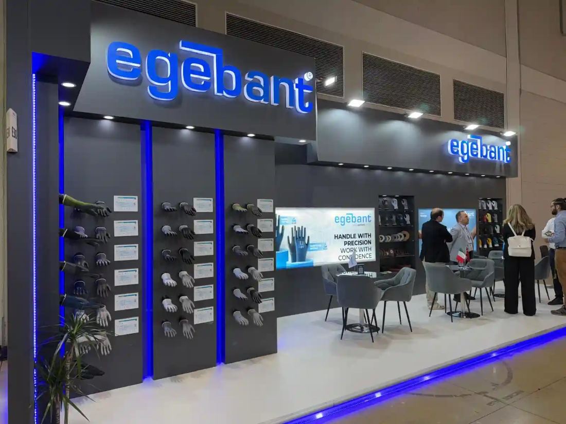 Egebant 10x30 inline trade show booth with backlit dimensional logo, product display towers and blue edge lighting