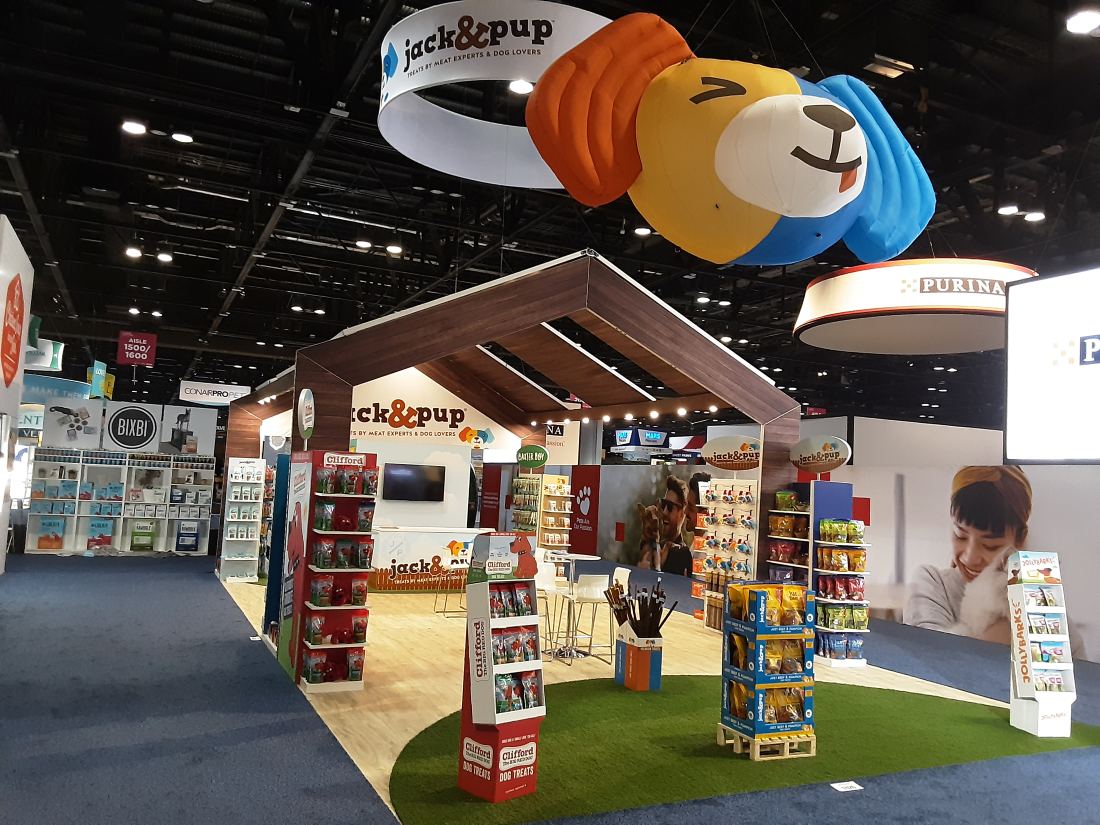 Jack and Pup 20x30 island trade show booth with a giant inflatable dog head balloon