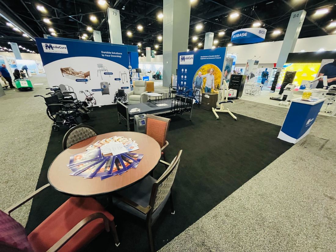 MedaCure 10x20 inline trade show booth with backlit header and medical equipment displays