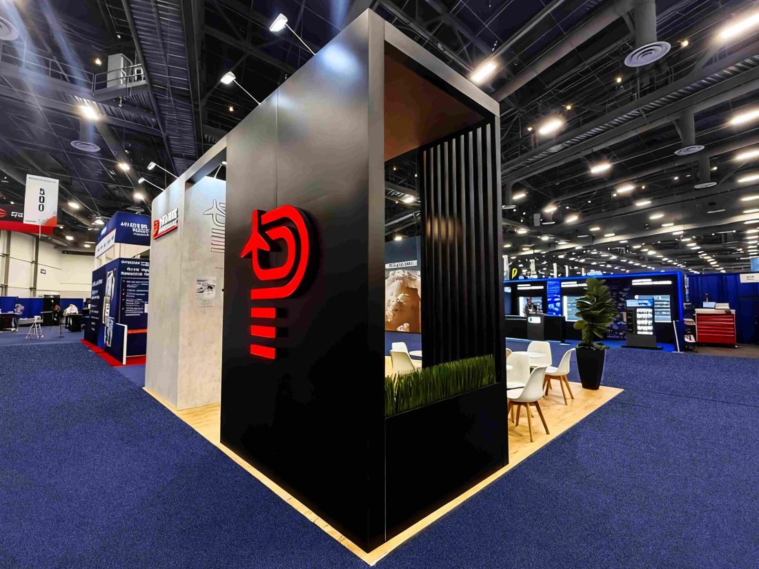 20x20 peninsula trade show booth at SHOT Show with a red-lit accent wall and lounge seating