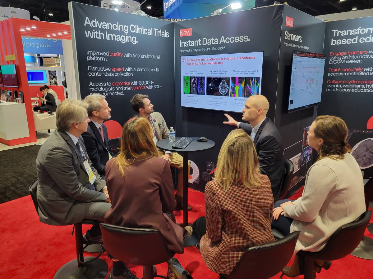 Booth representatives in conversation at RSNA 2025, McCormick Place
