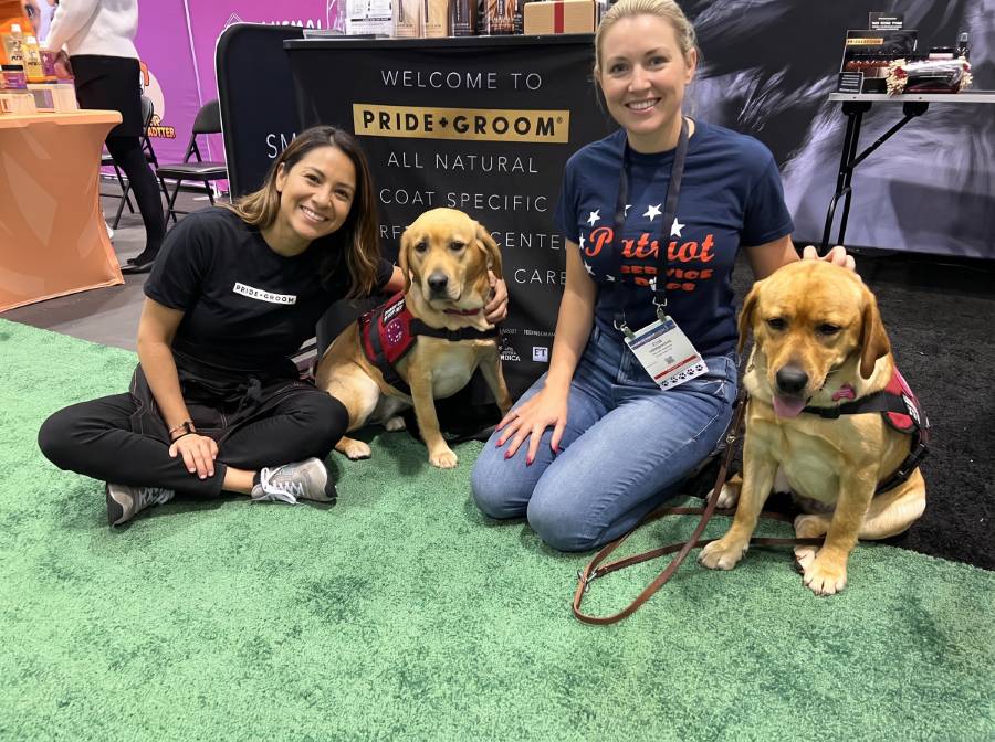 Brand ambassadors with dogs at Global Pet Expo